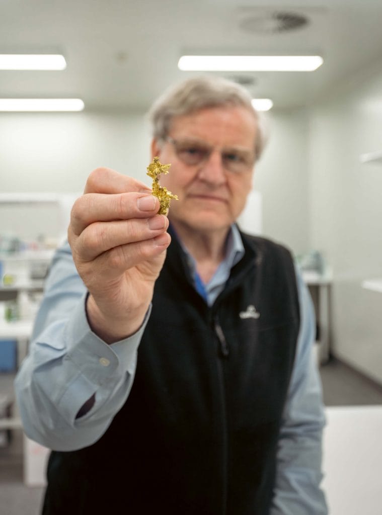 Scientist with gold sample